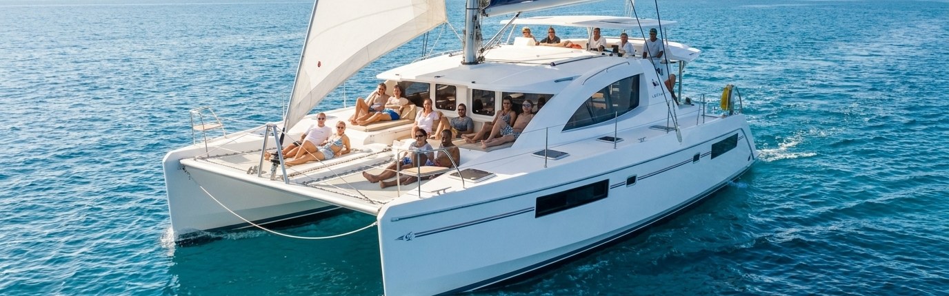 Leopard 39 catamaran under sail with a full crew aboard